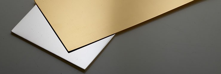 Fabricated gold and silver alloy sheets positioned on top of one another